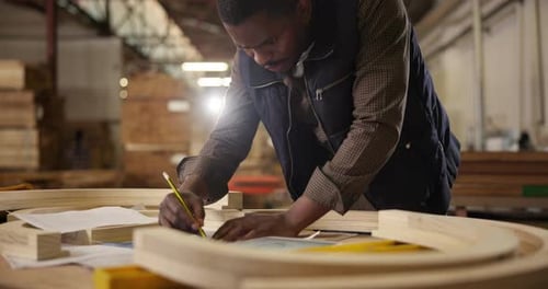 Wood, carpenter and creative while planning design in workshop for furniture