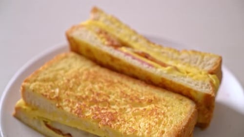 Close Up of Tasty Fried Ham and Egg Sandwich