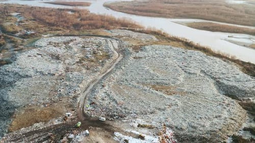 Aerial View of Garbage on City Landfill on the River Bank Garbage Pile in Trash Dump Environmental