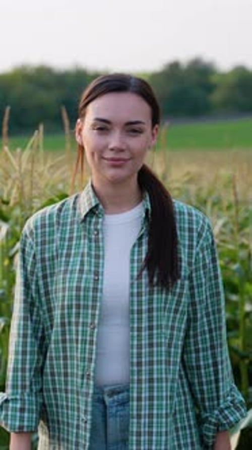 Young Woman Smiling in a Cornfield