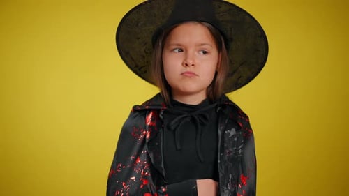 A Charming Young Witch Dressed in a Vibrant Festive Costume Perfect for Celebration and Halloween