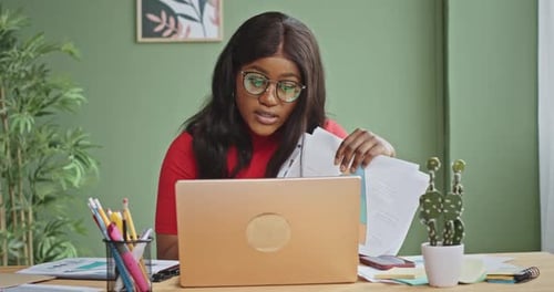 Woman Discussing Financial Data Over Video Call