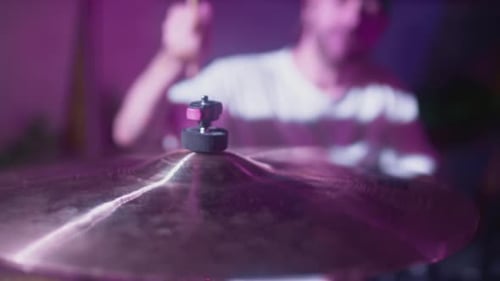 A Professional Male Artist Plays a Drum Kit