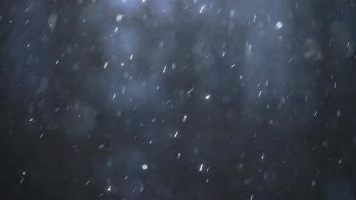 Abstract White Particle Snowfall on a Dark Background
