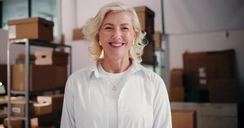 Smiling senior woman in a warehouse setting