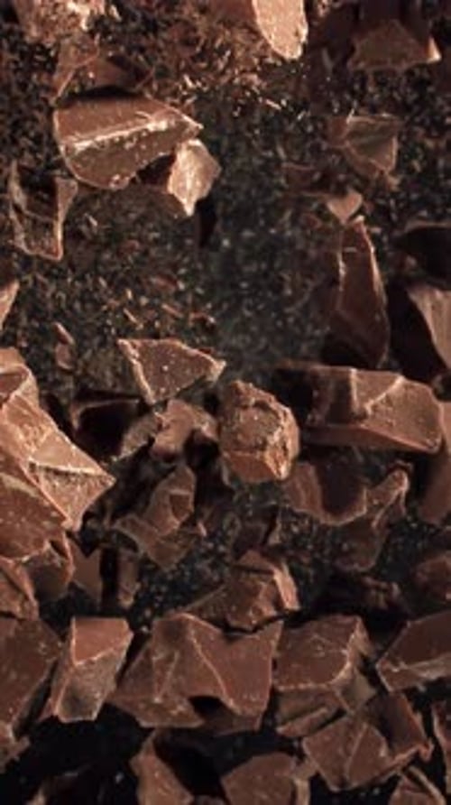 Pieces of Chocolate Fly Up and Fall Down Filmed on a Highspeed Camera at 1000 Fps