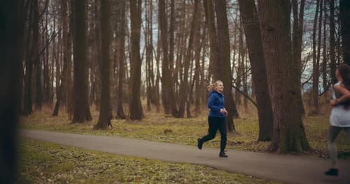 Two Woman Workout Exercising In Park Jogging Fitness