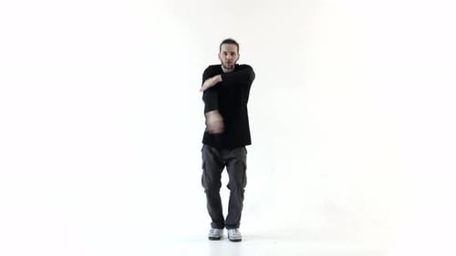 Man Dancing Choreographed Routine in White Studio
