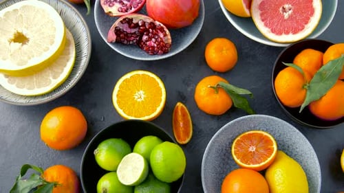 Food, Healthy Eating and Vegetarian Concept - Close Up of Citrus Fruits