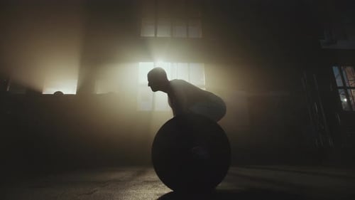 Athlete lifting heavy barbell