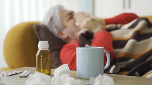 Man with lung disease coughs.