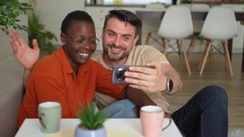 Smiling Couple Video Chatting Using a Mobile Phone