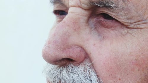 old man's look thinking of the future- close up