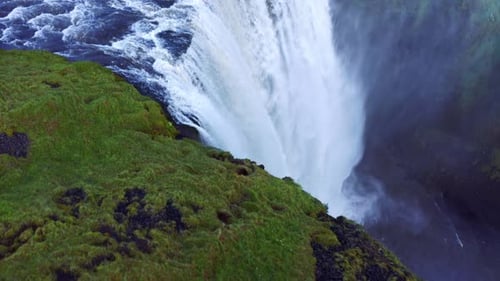 Famous And Dramatic Waterfall Skogafoss In Iceland - aerial drone shot