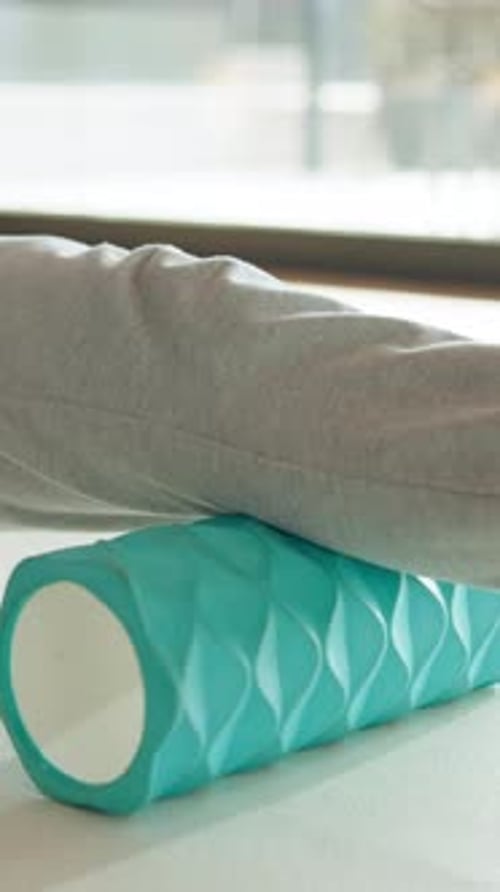 Leg Rolling on a Textured Blue Foam Roller