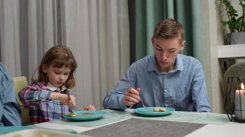 Children Enjoying Meal Together at Cozy Table