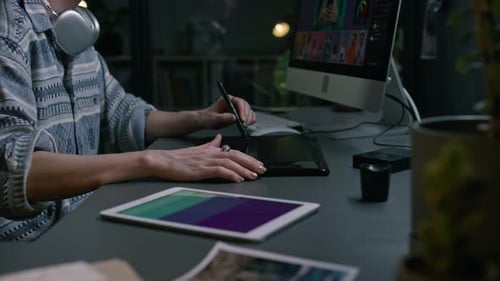 Graphic Designer Using Tablet and Editing Photos