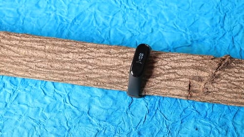 Finger Touches a Smart Watch on Branch