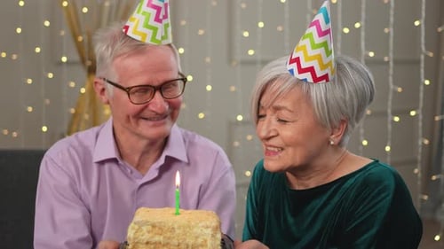 Joyful Senior Couple Celebrating Birthday Together