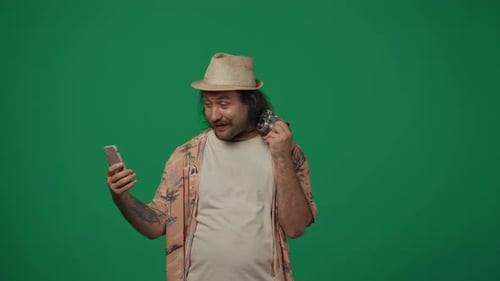 Enthusiastic Man Recording Himself with Phone and Camera