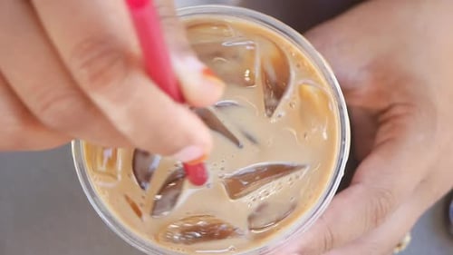 Close Up of Ice Cubes in a Glass of Coffee