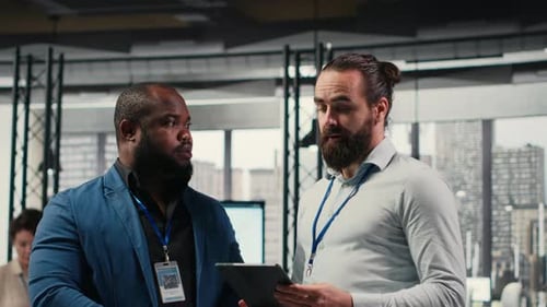 Businessmen Analysts Monitoring Efficiency Insights at the Workspace