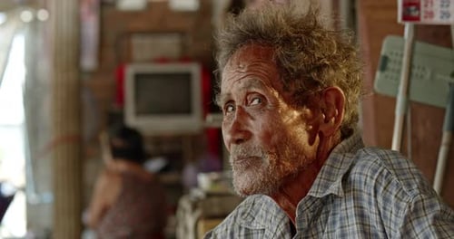 Senior Man Looking Around Indoors