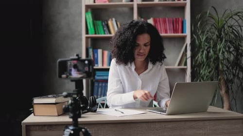 Woman Works at Laptop in Home Office Environment