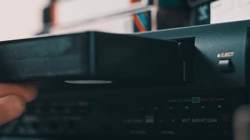 Insert VHS Cassette Into VCR Video Player
