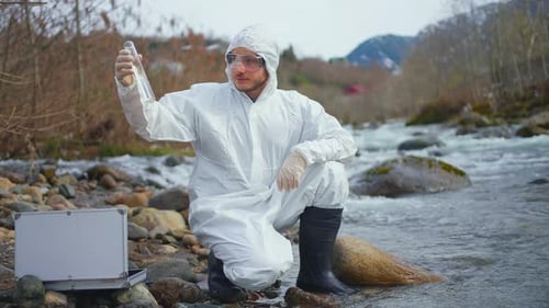 Scientist Biologist Test of Water in a Reservoir Check of Pollution Environmental Problem