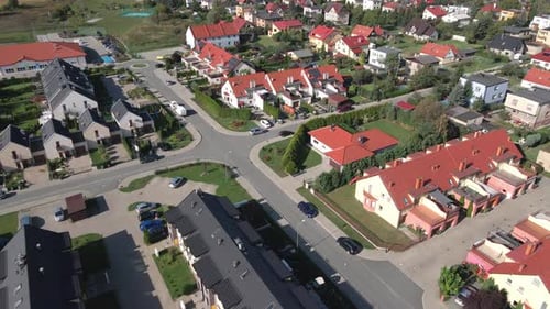 Aerial view of modern residential neighborhood with townhouses and parking areas