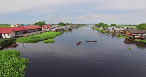 South Kalimantan, 10 Mey 2016, Boat crossing the black river of swamp village