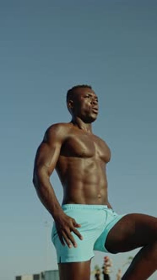 Athletic Man Doing High Knees Exercise