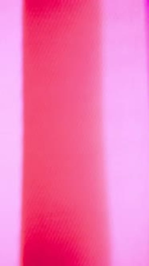 Vibrant abstract pink and red stripes create dynamic modern background art