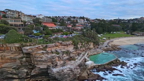 Oceanside Swimming Pool Of Bronte Baths And Sandy Waterfront Of Bronte Beach In Australia. aerial