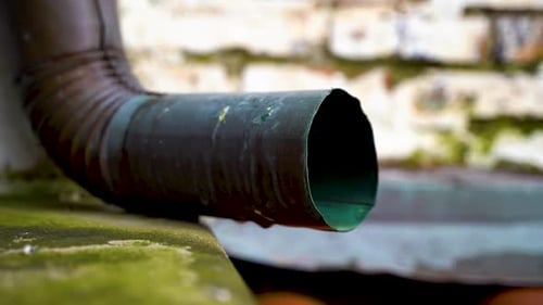 Drainage pipe dripping water in the garden