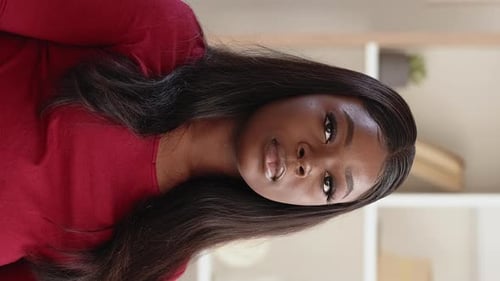 Woman Waving Hello in Close Up Indoor Shot