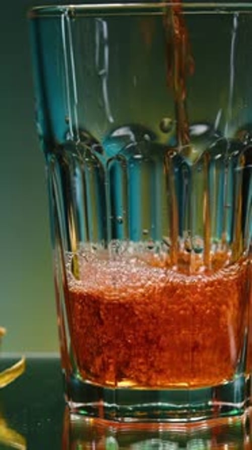 Beautiful Pouring of Drink Into Glass with Ingredients Stock Clip Refreshing Drink is Poured Into