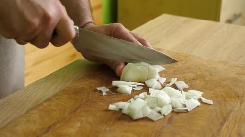 103. Finely chop the onion with a knife.