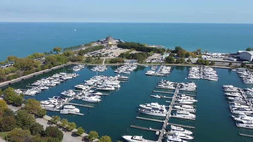 Aerial View of Marina By the Lake A Marina Filled with Boats and Yachts Located Near a Scenic