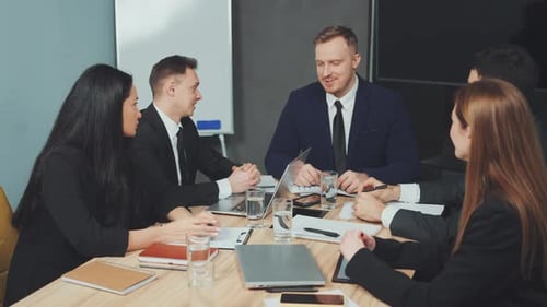 Business Team Meeting in Modern Office