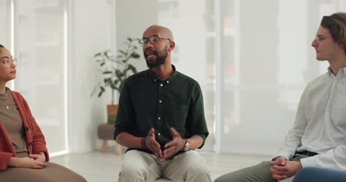 Talking therapist, black man and circle of people planning, listening and brainstorming in community