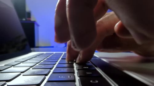 Close Up Moving Macro Shot of Person Typing on the Computer Keyboard