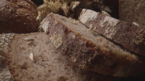 Rustic Bread and Ears of Wheat on the Old Vintage Table Baked Natural Bread ProRes