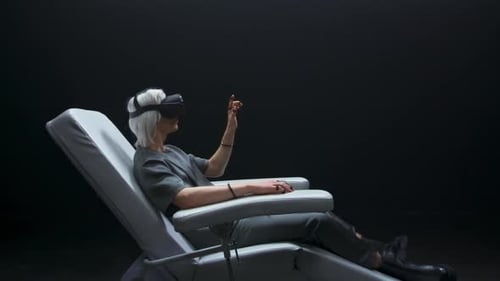 Woman using VR Headset in Futuristic Chair