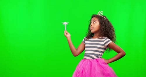 Child in costume, green screen with wand and crown on mockup with magic princess dress up in studio