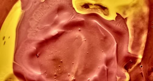Abstract Swirling Orange and Yellow Viscous Liquid