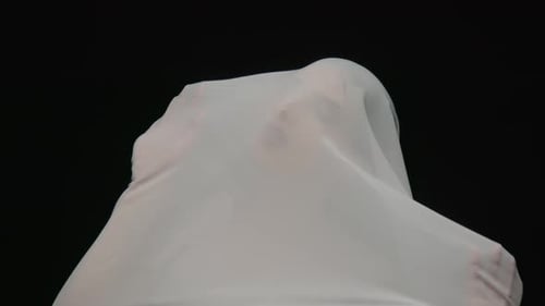 White Sheet Abstract Motion on Black Background