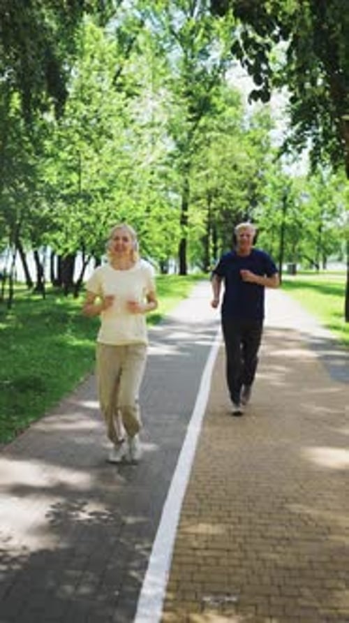 Senior Couple Jogging in Park