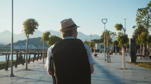 Happy Tourist Man Walking to Airport Terminal Vacation Exploring Interesting Places to Travel